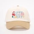 Zweifarbige Baseballkappe in Creme und Khaki mit Happy Go Lucky Stickerei und Symbolen - Cremeweiß/Dunkles Khaki