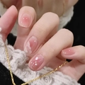 Short oval press-on nails with pink gradient art, white shell pieces, and small pearls - R486 Blush With Glitter / Nail Glue Version