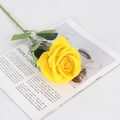 Single blooming yellow velvet artificial rose flower with green leaves on magazine - Large Velvet Yellow