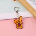 Cute acrylic bear keychain wearing orange bunny costume with cake for student bags - Bear with Cake