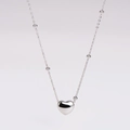 Macro view of polished silver heart pendant necklace with beaded metal chain detail - Heart Beaded Chain Necklace / Silver (Necklace)