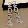 Silver drop earrings with sparkling 2024 number design and tassels on brown leather background - 2024 Number Tassel Style (56#)