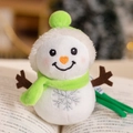 Plush snowman keychain with green hat and orange heart nose on an open book - Green / 12cm