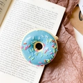 Retractable phone socket with 3D blue doughnut design on a vintage book background - Donut Holder-Blue