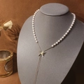 Élégant collier Y en perles avec pendentif papillon doré et pompon pour femmes - Doré