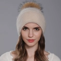 Elegant Angora fur knitted beanie for women featuring a fluffy raccoon fur pom-pom - Beige + Natural Fur Pom-pom