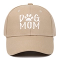 Close-up of white DOG MOM embroidery and paw print on khaki cotton baseball cap - Khaki