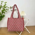 Detailed close-up of the red and white geometric wave knit texture on a large tote bag - Wave Red