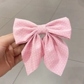 Elegant pink hair clip with white polka dots, featuring a large double-layered bow design - Polka Dot / Pink