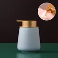 Blue ceramic soap dispenser with gold pump and matte finish for bathroom and kitchen - Rounded / Light Blue with Gold Pump