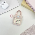 Detail of floral canvas earphone pouch with pink handle and snap button closure - Light Pink