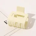 Close-up of large matte cream hair claw clip with square geometric grip structure - Small Rectangular - Matte Beige