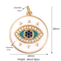 Gold-plated evil eye pendant with blue crystals and white enamel measuring 26x20mm - White Enamel Round Evil Eye Style (M184346K2)