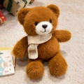 Dark brown plush teddy bear with a white knit scarf and smile leather label - Brown Scarf Style