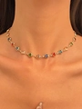 Close-up of golden necklace featuring vibrant colorful heart-shaped gemstones on a model - Multicolor Heart Necklace (N-216)