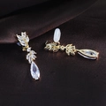 Detail of gold clip-on earrings with teardrop zircon and non-slip silicone pads - Gold Ear Clip