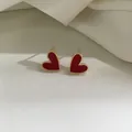 Elegant heart earrings in red finish with gold metal edge for a minimalist look - Red
