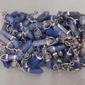 Bulk blue hexagonal crystal stone pendants with silver metal clasps in a storage bin - Blue Aventurine