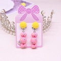 Pink candy-shaped clip-on earrings for kids on a bow card with pearl crown decor - Candy