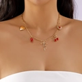 Close-up of gold cherry and strawberry pendants on a delicate layered chain necklace - Gold Thin Chain Strawberry Cherry Bow Heart Girl Necklace