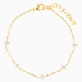 Close-up of elegant gold chain bracelet featuring five sparkling zircon clover charms - Gold