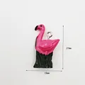 Pink flamingo resin pendant with green grass base and size markings 27mm by 15mm - Flamingo