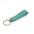 Green leather keychain with gold metal clasp and rivet on a white background - Emerald Green & Gold