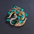 Elegant gold peacock brooch featuring green drop gemstones and sparkling clear crystals - Gold Green Gemstone Enamel Peacock