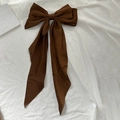 Elegant large coffee brown bow hair clip with long silk ribbons on white background - Brown