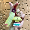 3D Pompompurin dog keychain with yellow cake charm and branded silicone strap - Sanrio Cake-Pompompurin