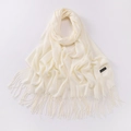 Detail view of cream white scarf with fringe, soft cashmere texture and side label - Beige