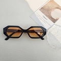 Octagonal sunglasses with black frames and brown gradient lenses on a minimalist background - Black Orange