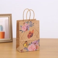 Kraft paper gift bag with floral butterfly print on a rustic wooden tabletop - H21*L15*W8 / 703-1 Butterfly & Rose