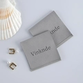 Set of two grey velvet jewelry pouches with flap closure and elegant brand logo - Gray