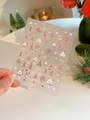 Close-up of laser gold Christmas nail stickers with fireworks and snowflake designs - Laser Bronzing YT4637mcpro
