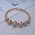Detail of 14K gold plated wire wrapped bracelet with natural freshwater pearls - Gold Multi-Pearl Wrap / Gold
