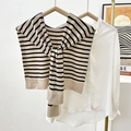 Knitted black and beige striped shawl capelet tied over a white long sleeve shirt - Light Coffee Striped
