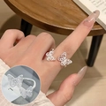 Vintage silver hollow butterfly ring with sparkling cubic zirconia on a model's finger - Dual Butterfly Zircon Inlay(JZ5333)