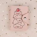 Pink PU leather mini card holder with cute cartoon pigs and a secure snap closure - Stacked Pigs