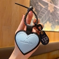 Light blue heart leather keychain pendant with black strap and small decorative tag - Leather-Blue Heart