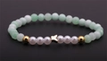 Bracelet tendance en perles de cristal vert et nacre avec un pendentif papillon doré - Papillon Vert