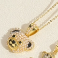 Detail of 14K gold plated bear pendant necklace with white pearl inlay and zircon accents - Small Artificial Pearl Bear Necklace (XL2380)