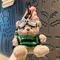 Plush bear keychain wearing goggles and green striped sweater with metal clip - Black/Green Outfit Plush Bear