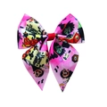 Detail of pink ribbed Halloween hair bow featuring Happy Halloween print and graphics - Hair Clip Style / Pink