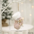 Pink plush Christmas stocking ornament with wooden reindeer and fur trim on a tree - Pink Christmas Stocking