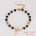 Detail of golden stainless steel beaded bracelet with heart and lightning bolt charms - Heart and Lightning Pendant Style