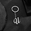Polished silver stainless steel keychain featuring a stylized artistic letter A pendant - Letter U