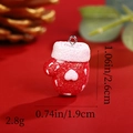Close-up of a red glitter Christmas glove resin pendant with dimensions 2.6cm x 1.9cm - Red and White Snowflake Christmas Glove