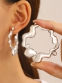 Silver liquid metal lava earrings in irregular drop style on a minimalist background - Silver Large Lava Hoop