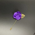 Macro detail of purple satin rose brooch with gold hollow leaf and metal suit pin - Deep purple